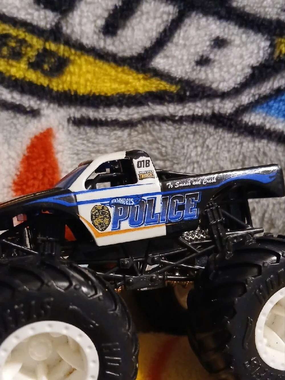 Police Hot Wheels Monster Truck Toy — Black, White & Blue